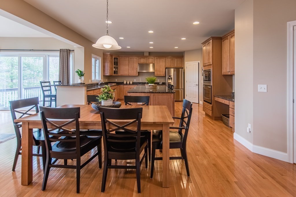 74 Canterbury Hill Road Acton, MA 01720 - Photo 10 of 37 a view of a dining room with furniture and wooden floor