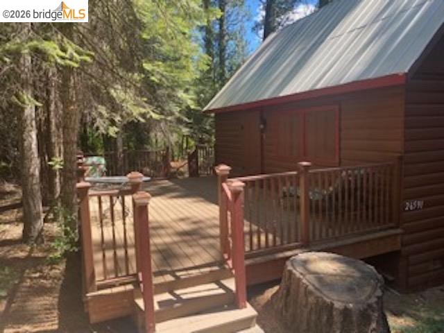 26591 Snow Bowl Road Long Barn, CA 95335 - Photo 27 of 38 a backyard of a house with table and chairs
