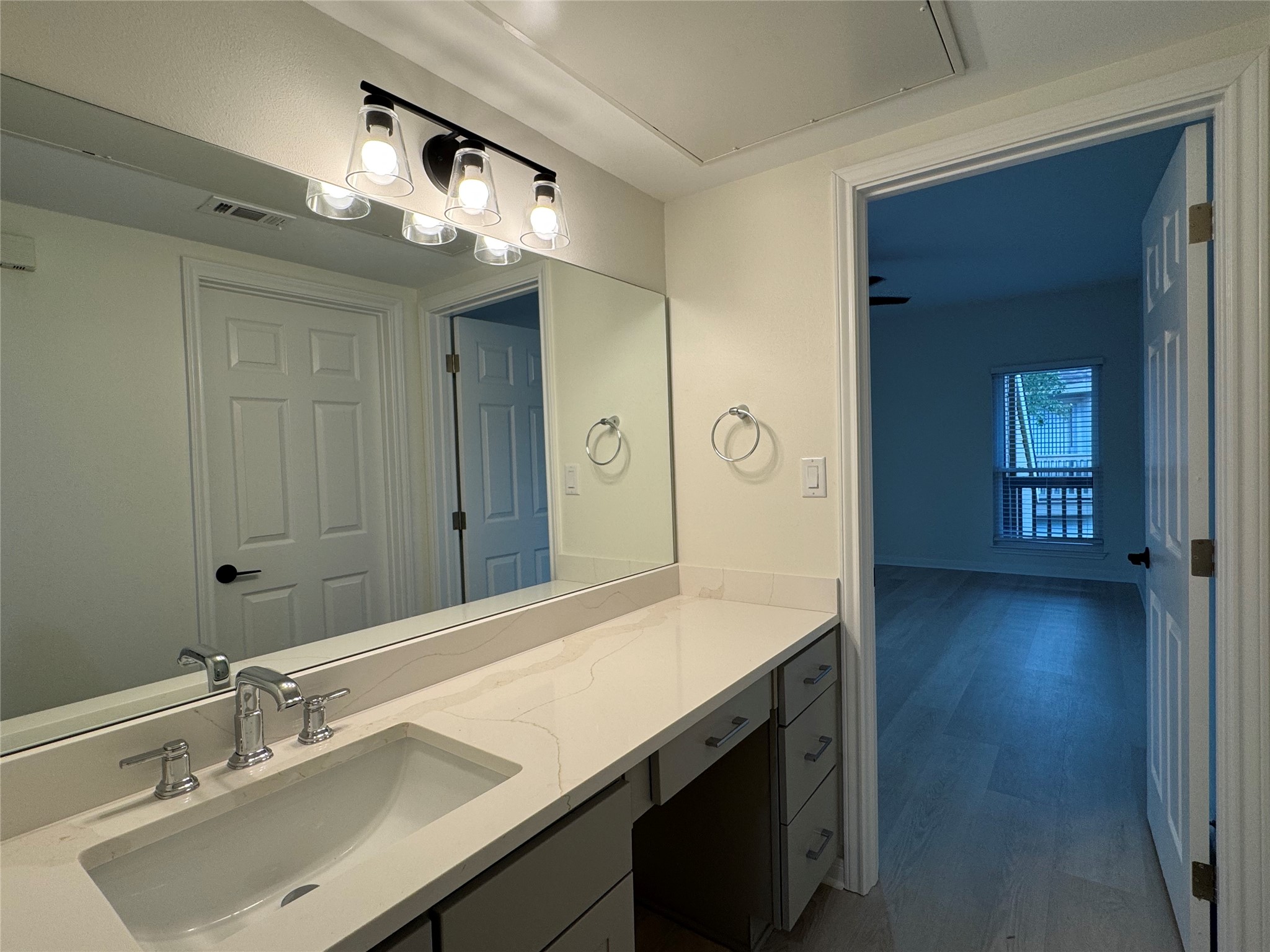 2100 Tanglewilde Street, Unit 626 Houston, TX 77063 - Photo 20 of 36 Reverse view of vanity leading to second bedroom