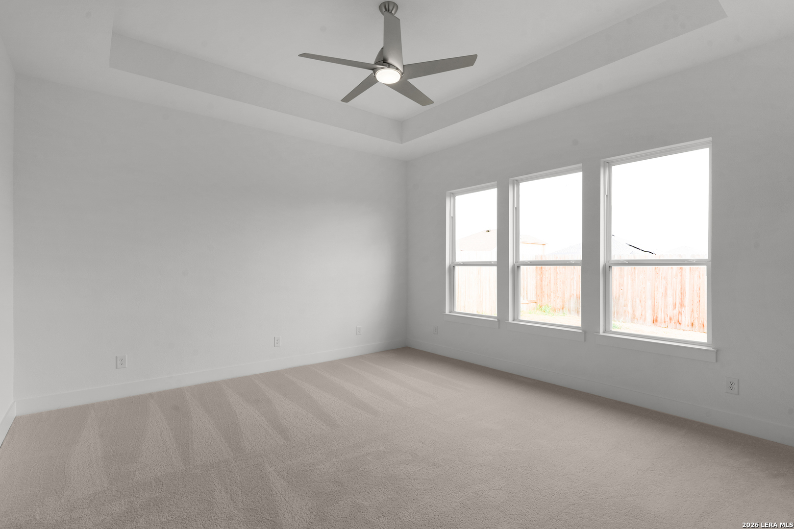 940 Nolte Bend Seguin, TX 78155 - Photo 8 of 19 an empty room with a window and a ceiling fan