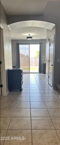 a view of an empty room and a window