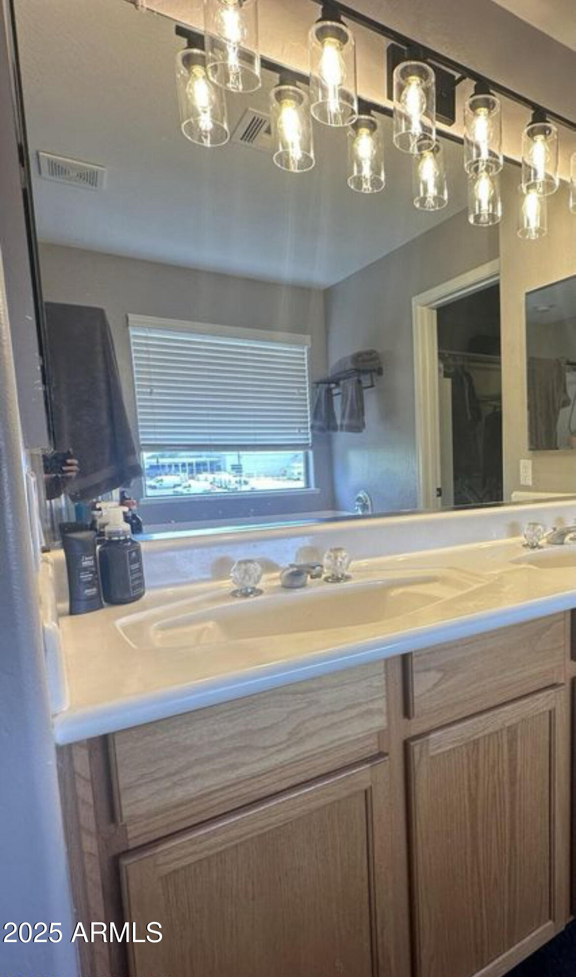 90 West Beechnut Place Chandler, AZ 85248 - Photo 23 of 32 a bathroom with a sink a large mirror and vanity