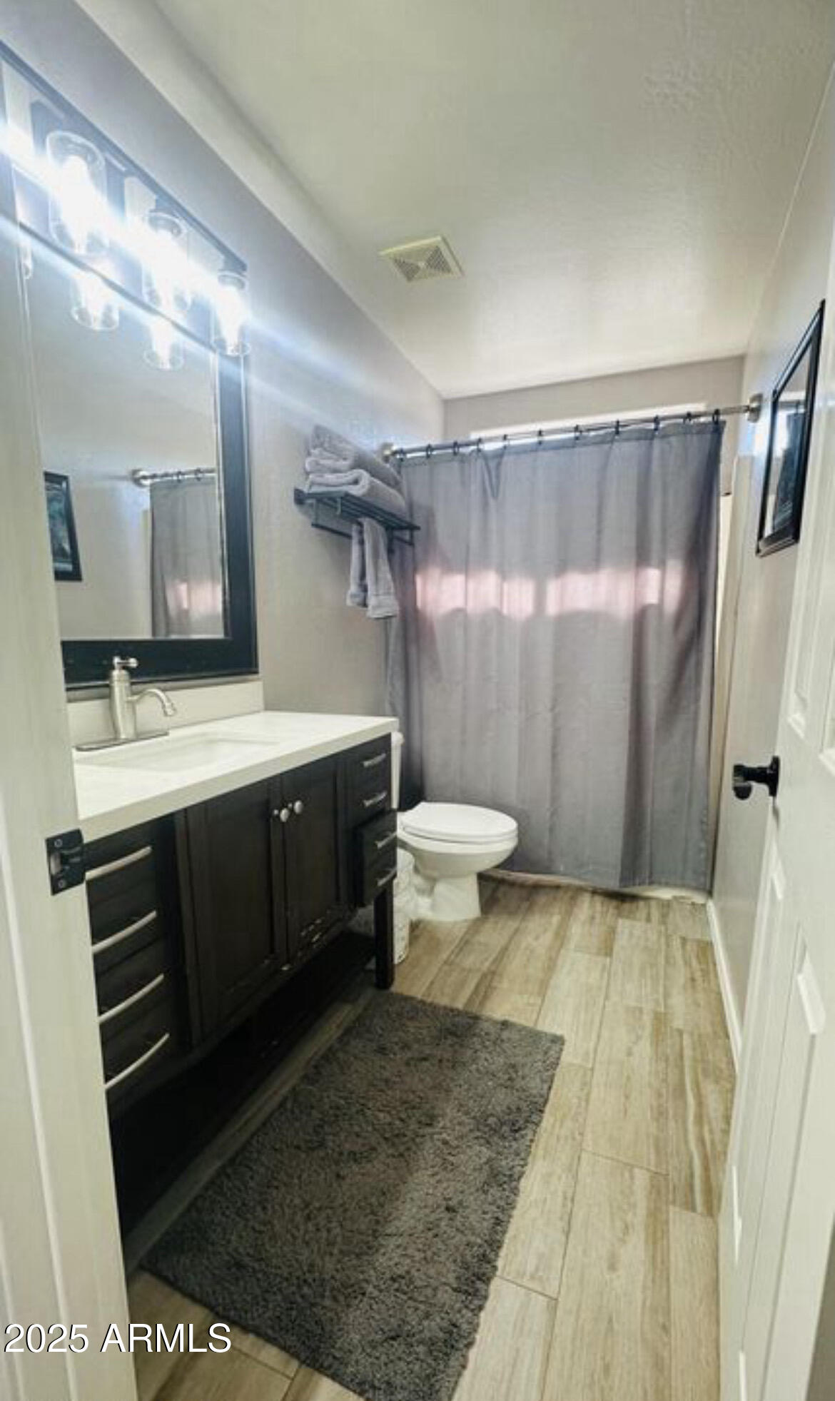 90 West Beechnut Place Chandler, AZ 85248 - Photo 24 of 32 a bathroom with a sink a toilet a mirror and shower