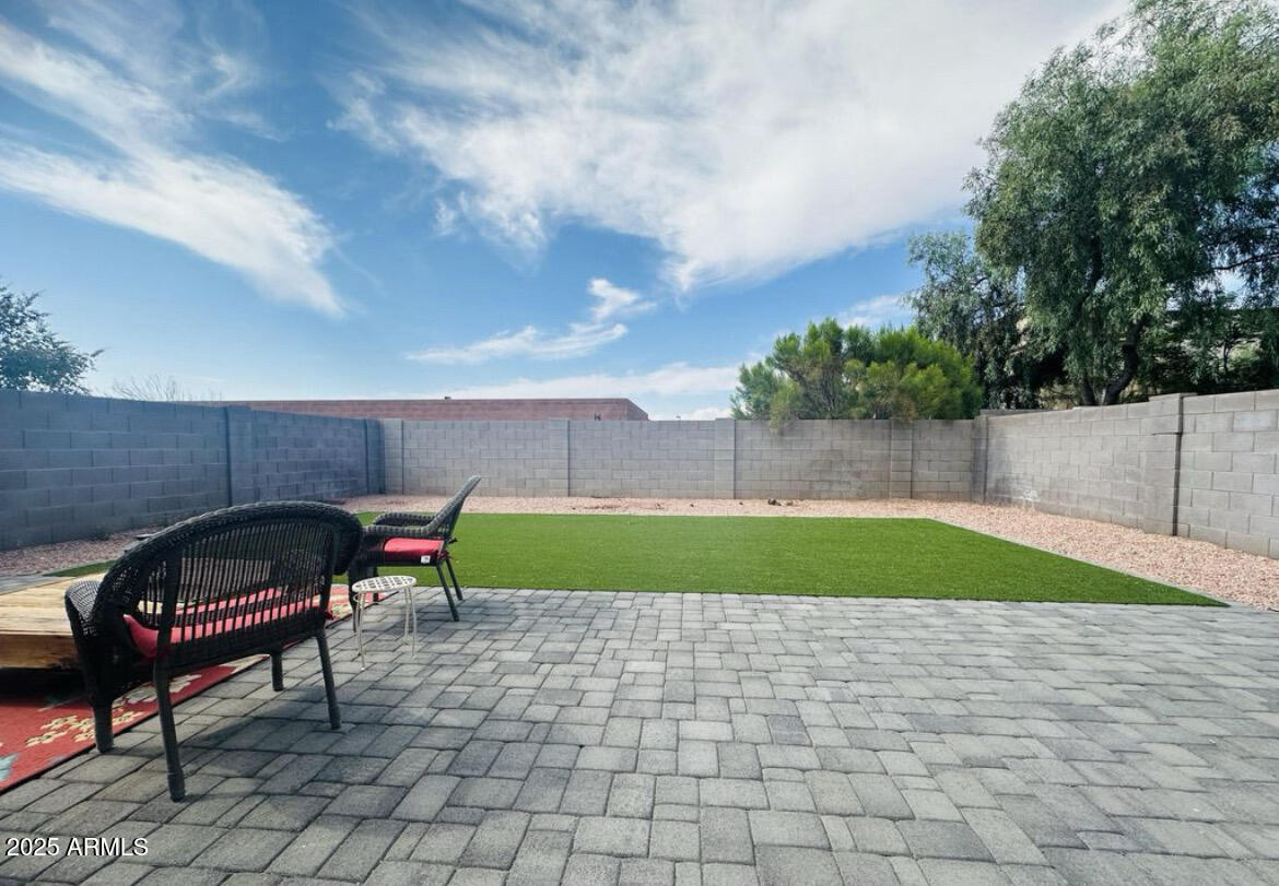 90 West Beechnut Place Chandler, AZ 85248 - Photo 28 of 32 a swimming pool with outdoor seating and garden