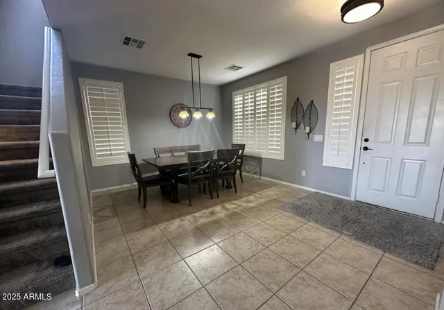 a view of a livingroom with furniture and window