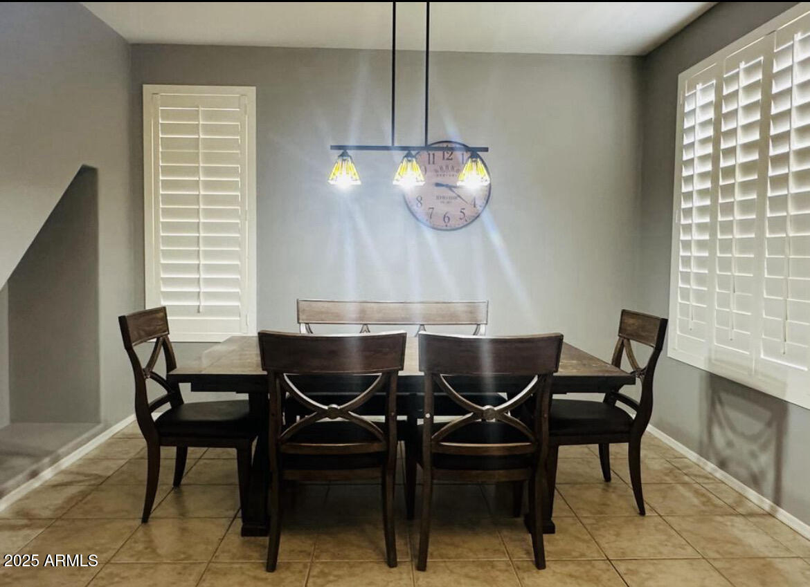 90 West Beechnut Place Chandler, AZ 85248 - Photo 7 of 32 a view of a dining room with furniture and chandelier