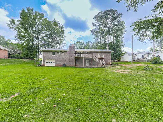 a backyard of a house with lots of green space