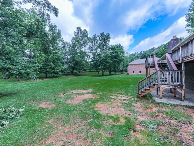 a view of roof deck with furniture
