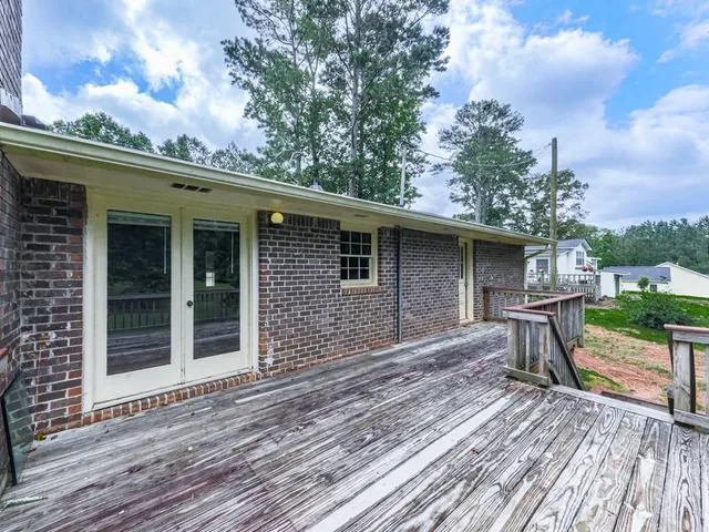 a view of deck and a yard