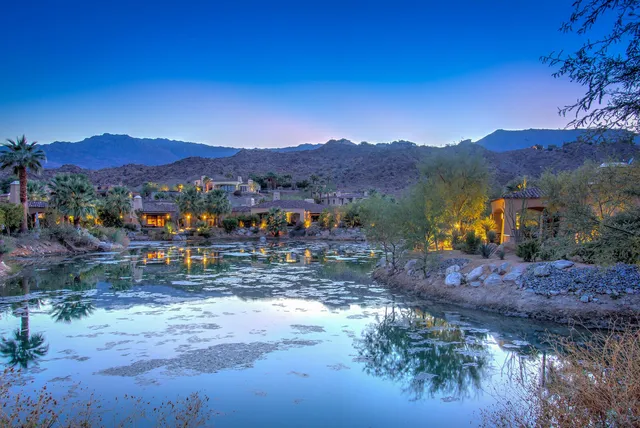 a view of a town with mountains in the background