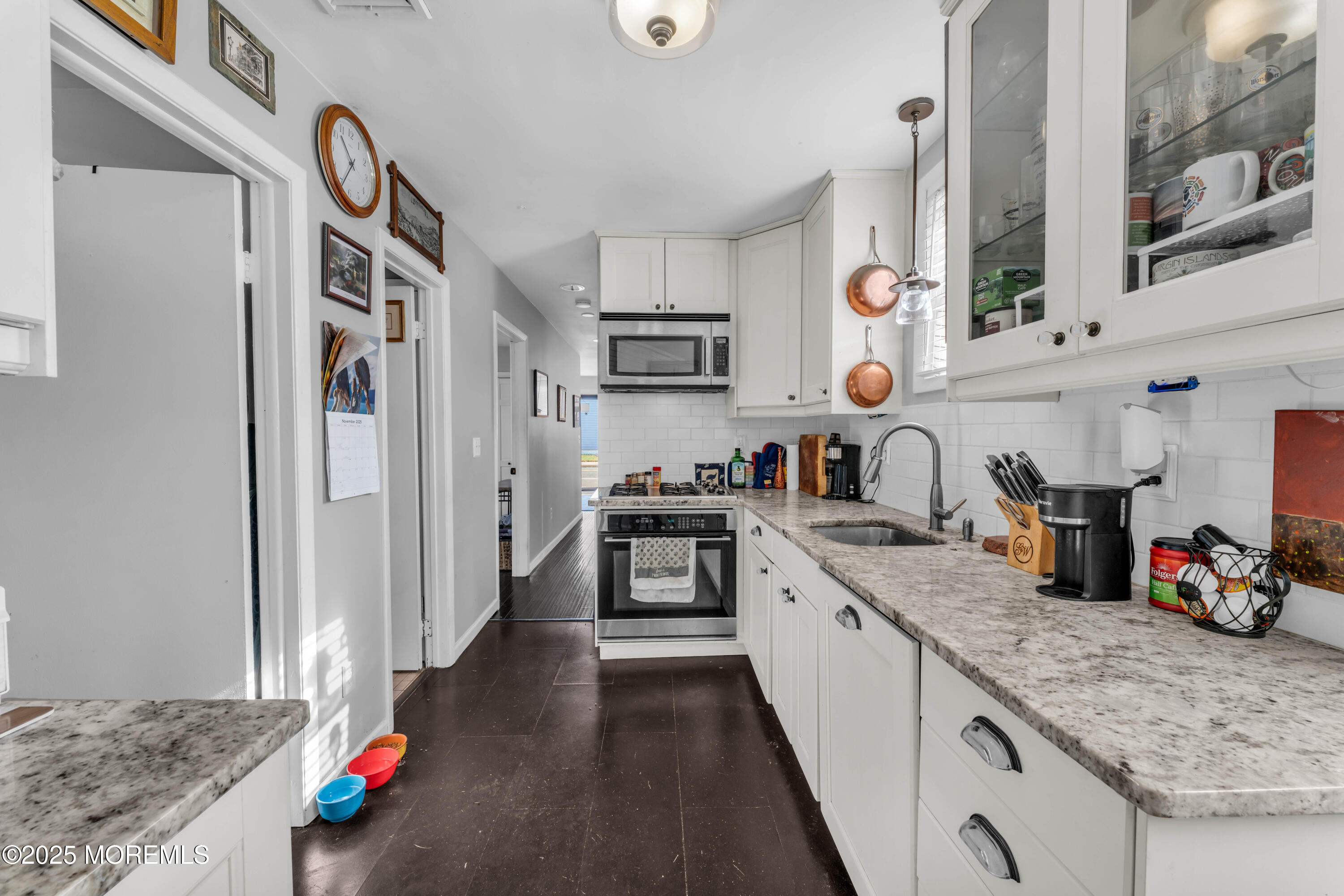 1217 Union Avenue Union Beach, NJ 07735 - Photo 11 of 26 a kitchen with stainless steel appliances granite countertop a refrigerator and a sink