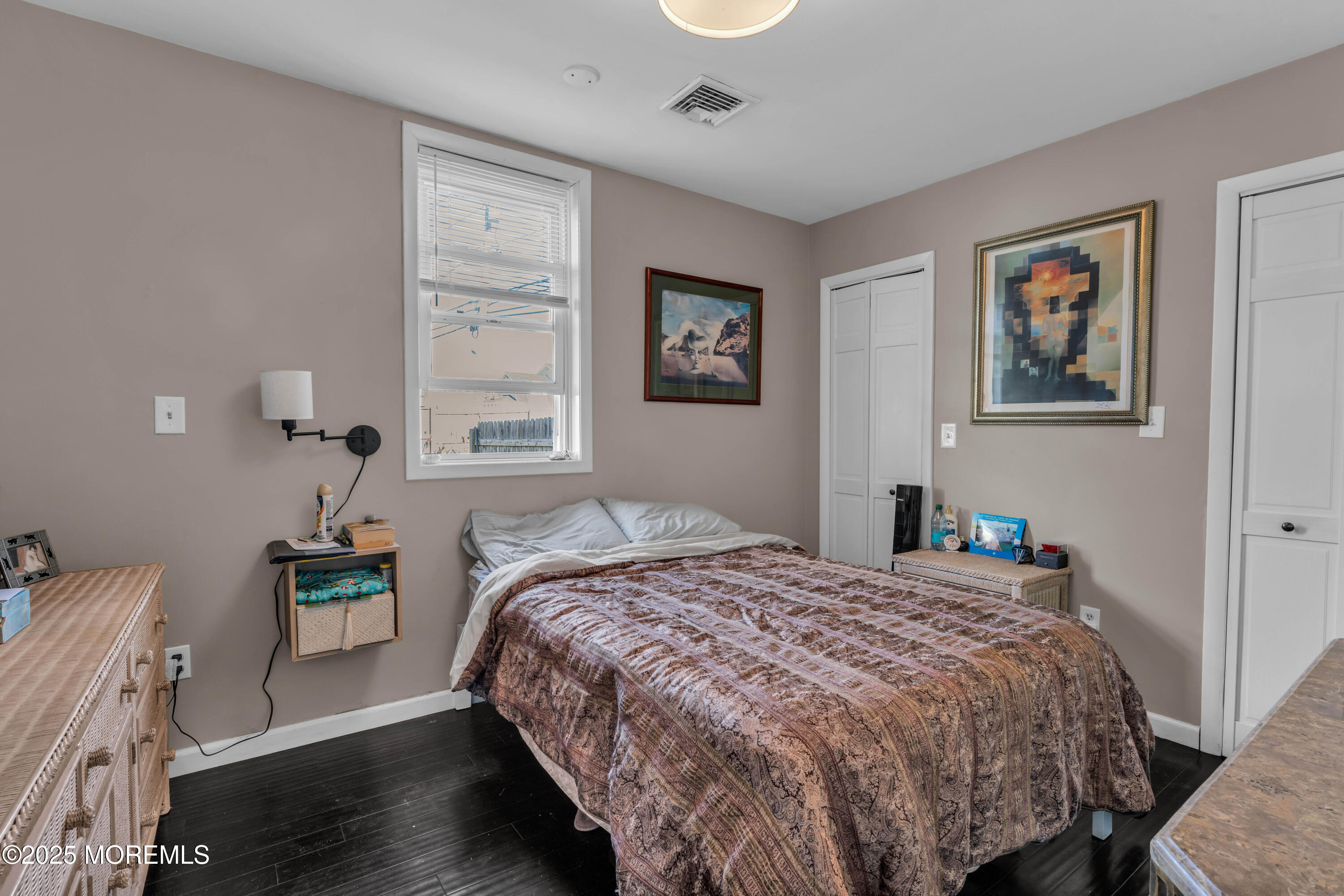 1217 Union Avenue Union Beach, NJ 07735 - Photo 25 of 26 a bedroom with a bed and wooden floor