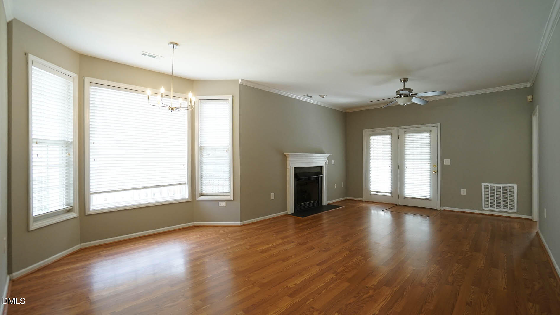 41 Signet Drive Durham, NC 27705 - Photo 11 of 34 a view of an empty room with a window and wooden floor