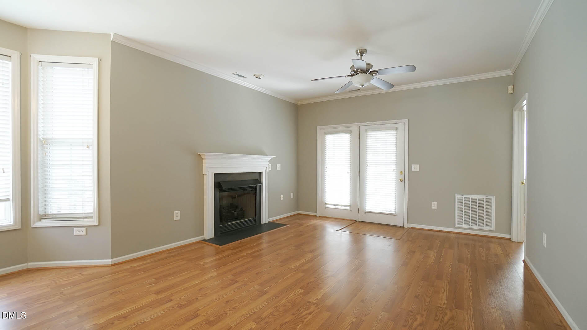 41 Signet Drive Durham, NC 27705 - Photo 14 of 34 a view of an empty room with window and wooden floor