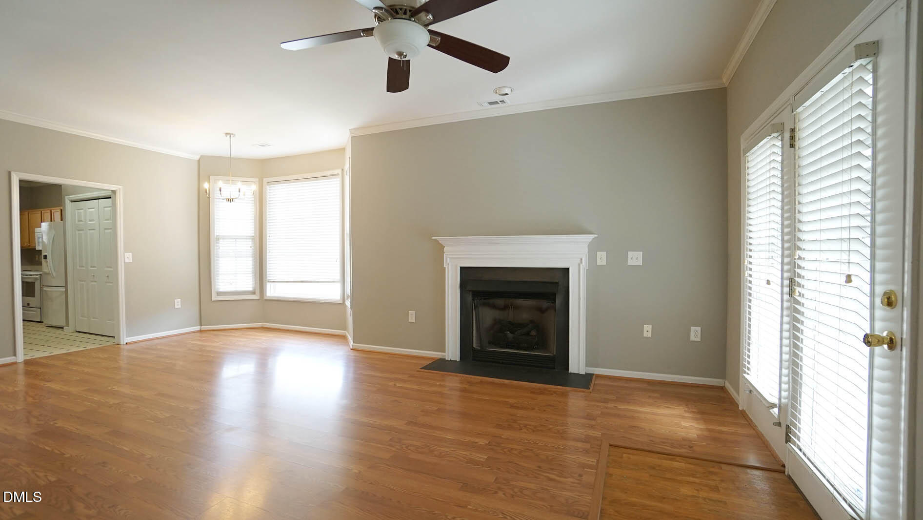 41 Signet Drive Durham, NC 27705 - Photo 15 of 34 wooden floor fireplace and windows in an empty room