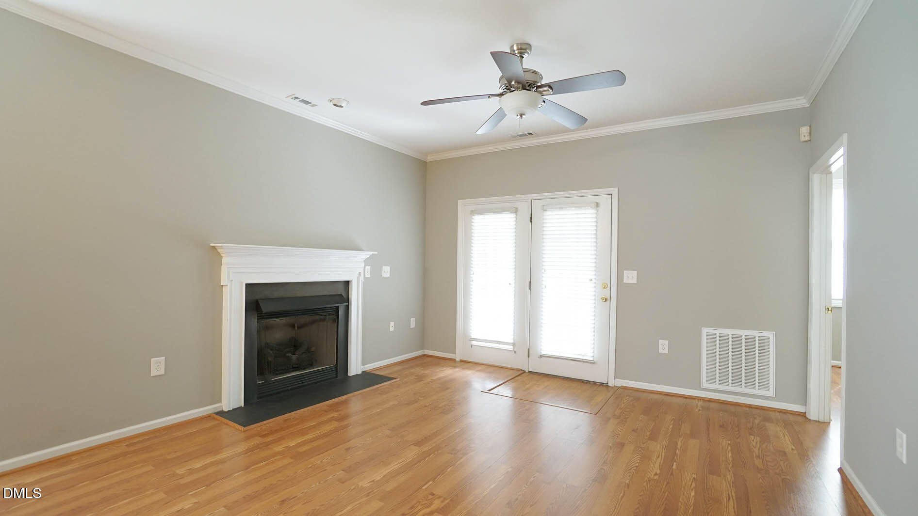 41 Signet Drive Durham, NC 27705 - Photo 17 of 34 a view of an empty room with a fireplace and a window