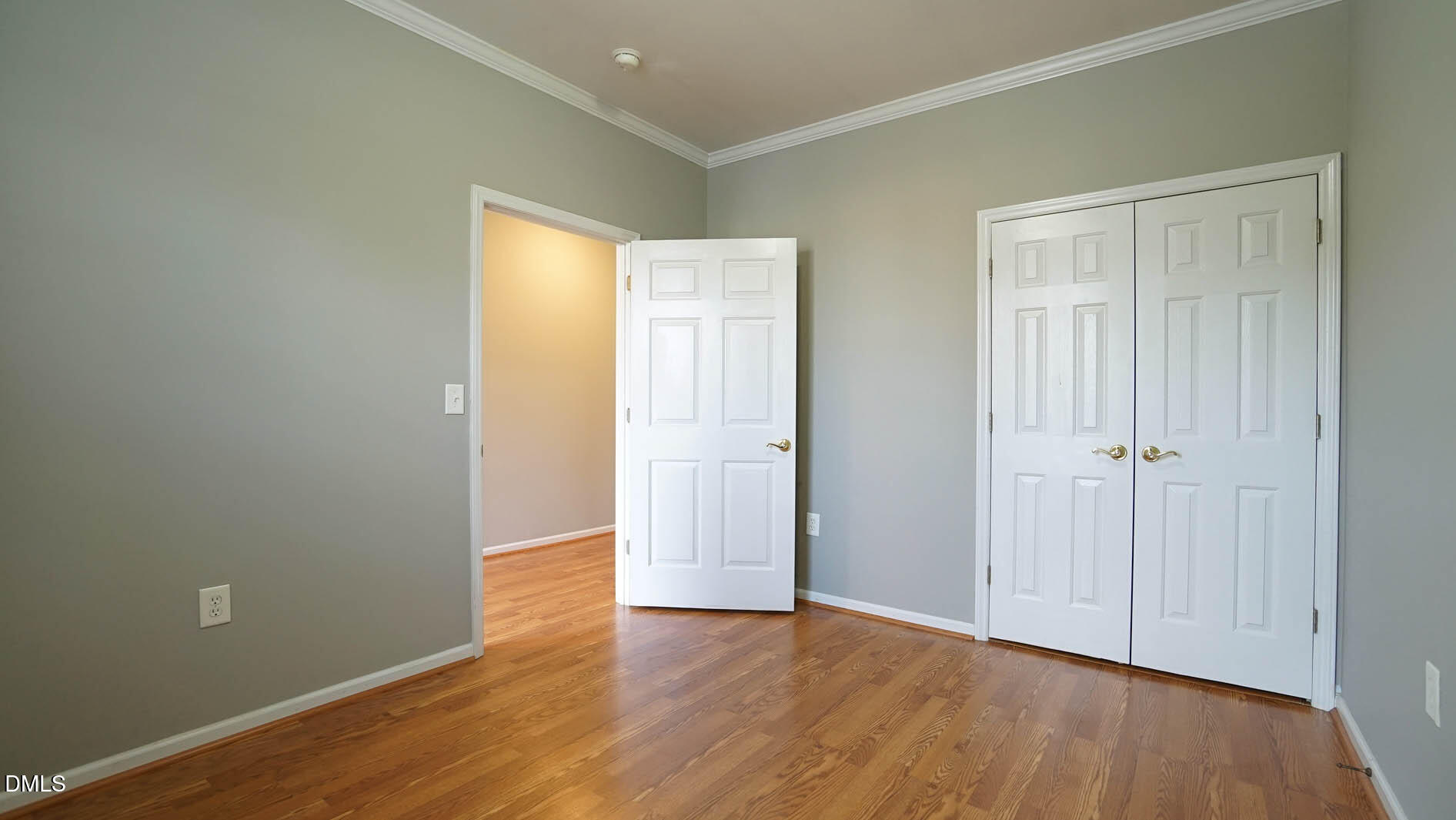41 Signet Drive Durham, NC 27705 - Photo 19 of 34 a view of an empty room with wooden floor and closet