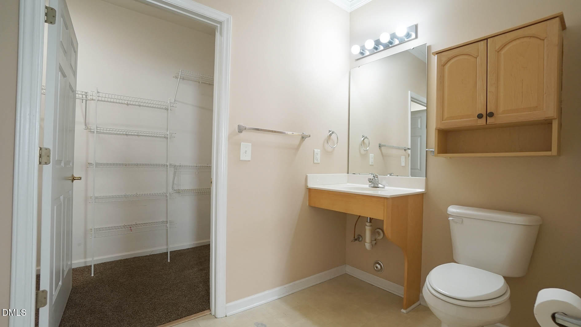 41 Signet Drive Durham, NC 27705 - Photo 24 of 34 a bathroom with a sink a toilet a mirror and shower