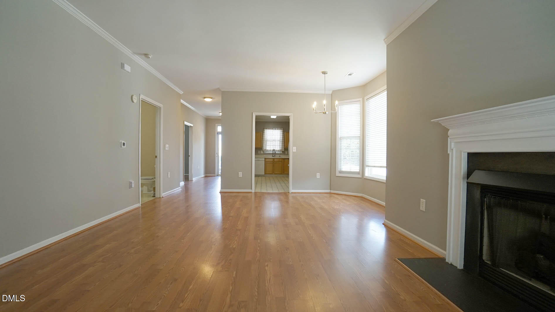 41 Signet Drive Durham, NC 27705 - Photo 27 of 34 a view of an empty room with wooden floor and a fireplace