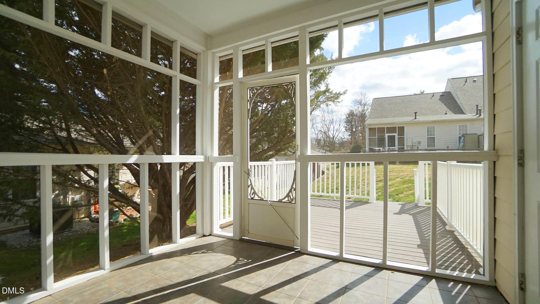 41 Signet Drive Durham, NC 27705 - Photo 28 of 34 a view of a balcony with floor to ceiling windows with wooden floor
