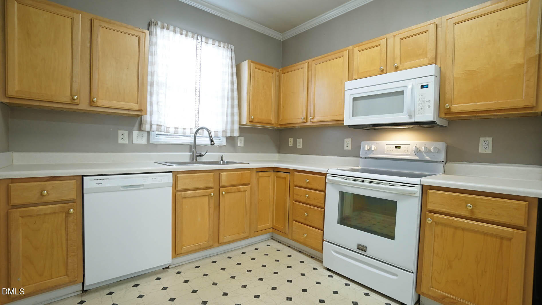 41 Signet Drive Durham, NC 27705 - Photo 6 of 34 a kitchen with granite countertop a sink stove and microwave