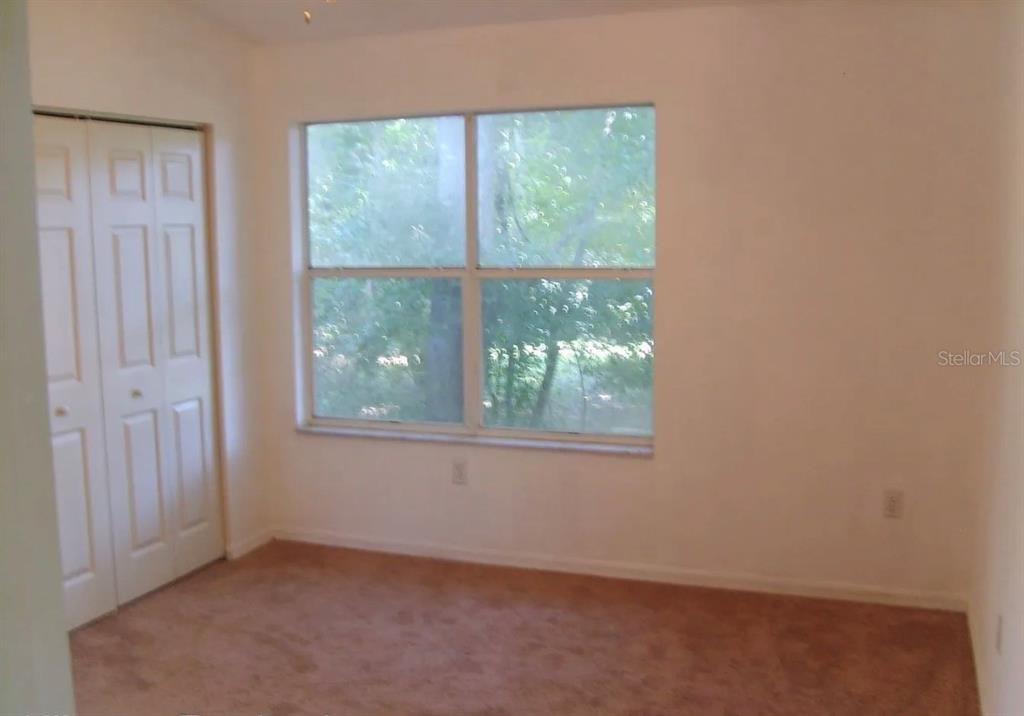 4415 Southwest 34th Street, Unit 708 Gainesville, FL 32608 - Photo 5 of 9 an empty room with a window