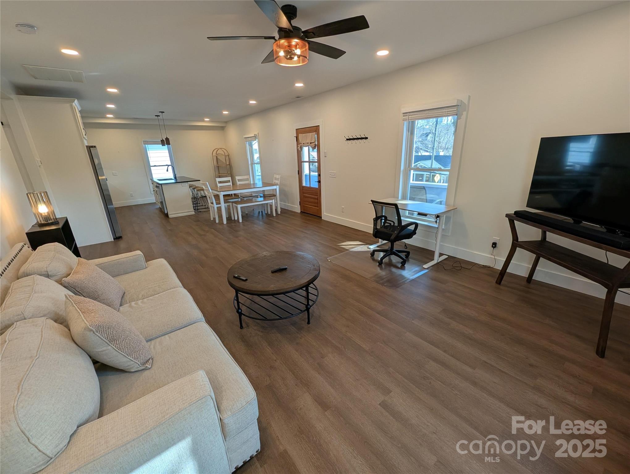 24 Woodrow Avenue Asheville, NC 28801 - Photo 11 of 30 a living room with furniture and a flat screen tv