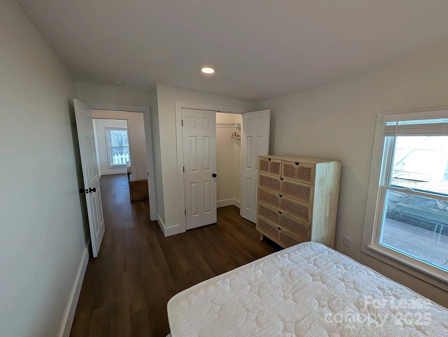 24 Woodrow Avenue Asheville, NC 28801 - Photo 17 of 30 a view of a hallway with wooden floor and closet