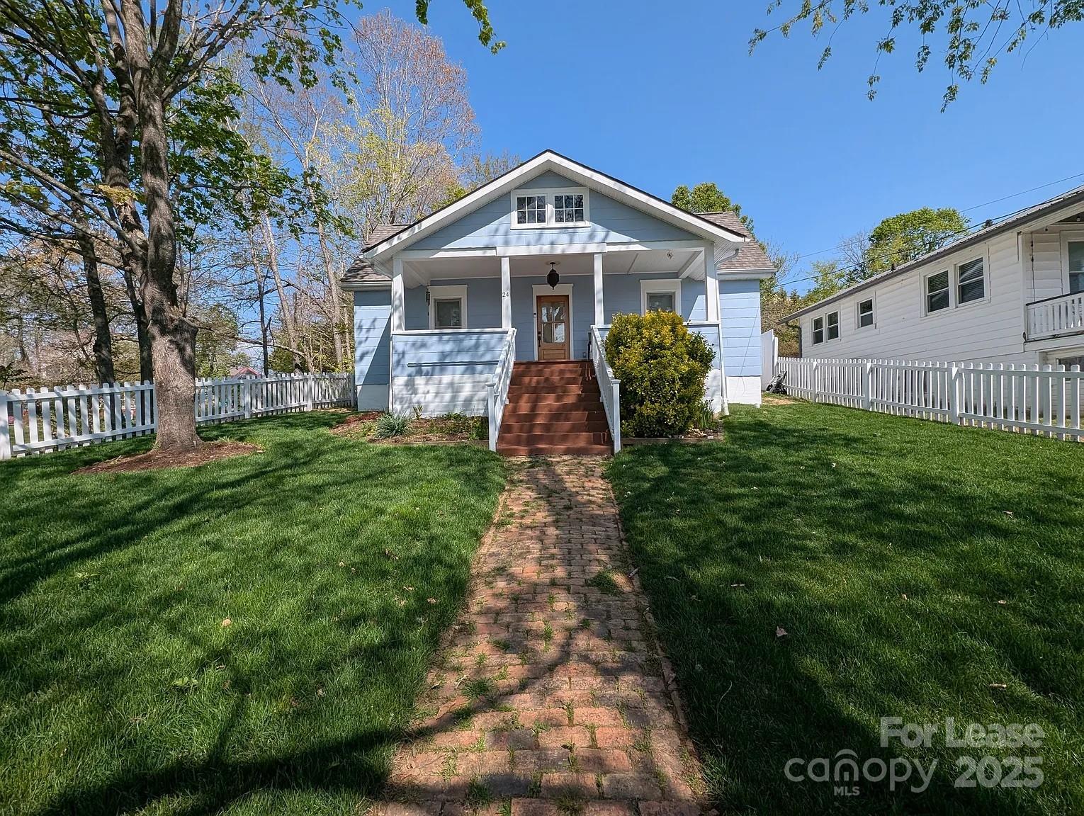 24 Woodrow Avenue Asheville, NC 28801 - Photo 2 of 30 a front view of a house with a yard