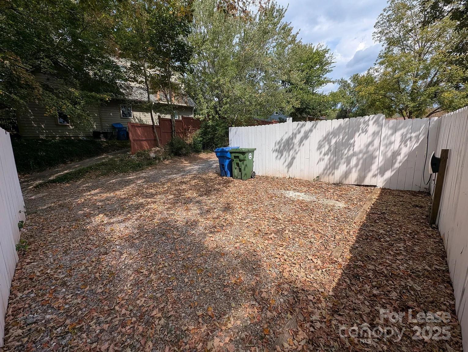 24 Woodrow Avenue Asheville, NC 28801 - Photo 29 of 30 a view of backyard with a barn and large trees