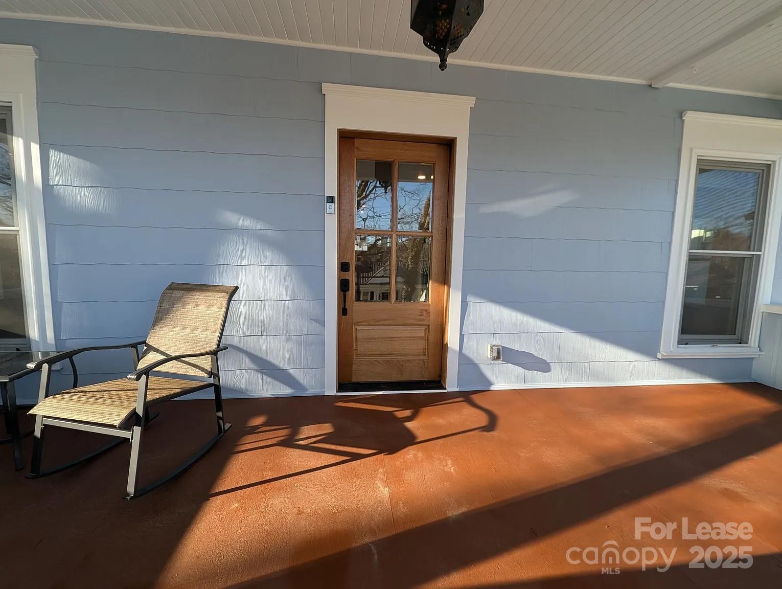 24 Woodrow Avenue Asheville, NC 28801 - Photo 4 of 30 a view of a livingroom with chairs and couch
