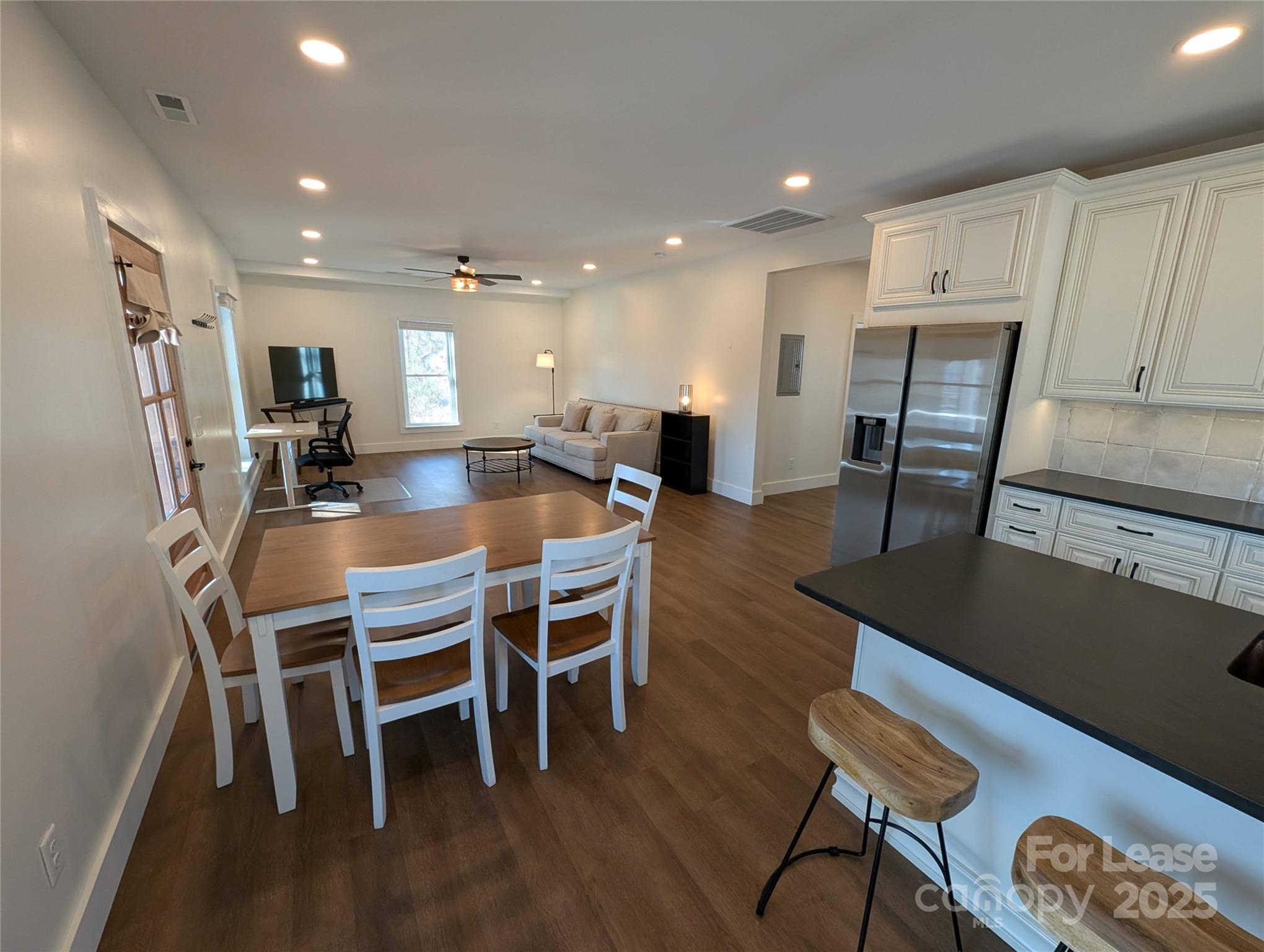 24 Woodrow Avenue Asheville, NC 28801 - Photo 9 of 30 a dining room with furniture and wooden floor