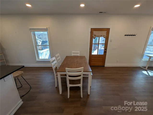 a workspace with furniture window and wooden floor
