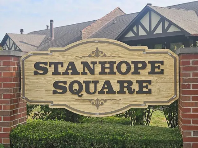 a view of front of house with yard and green space