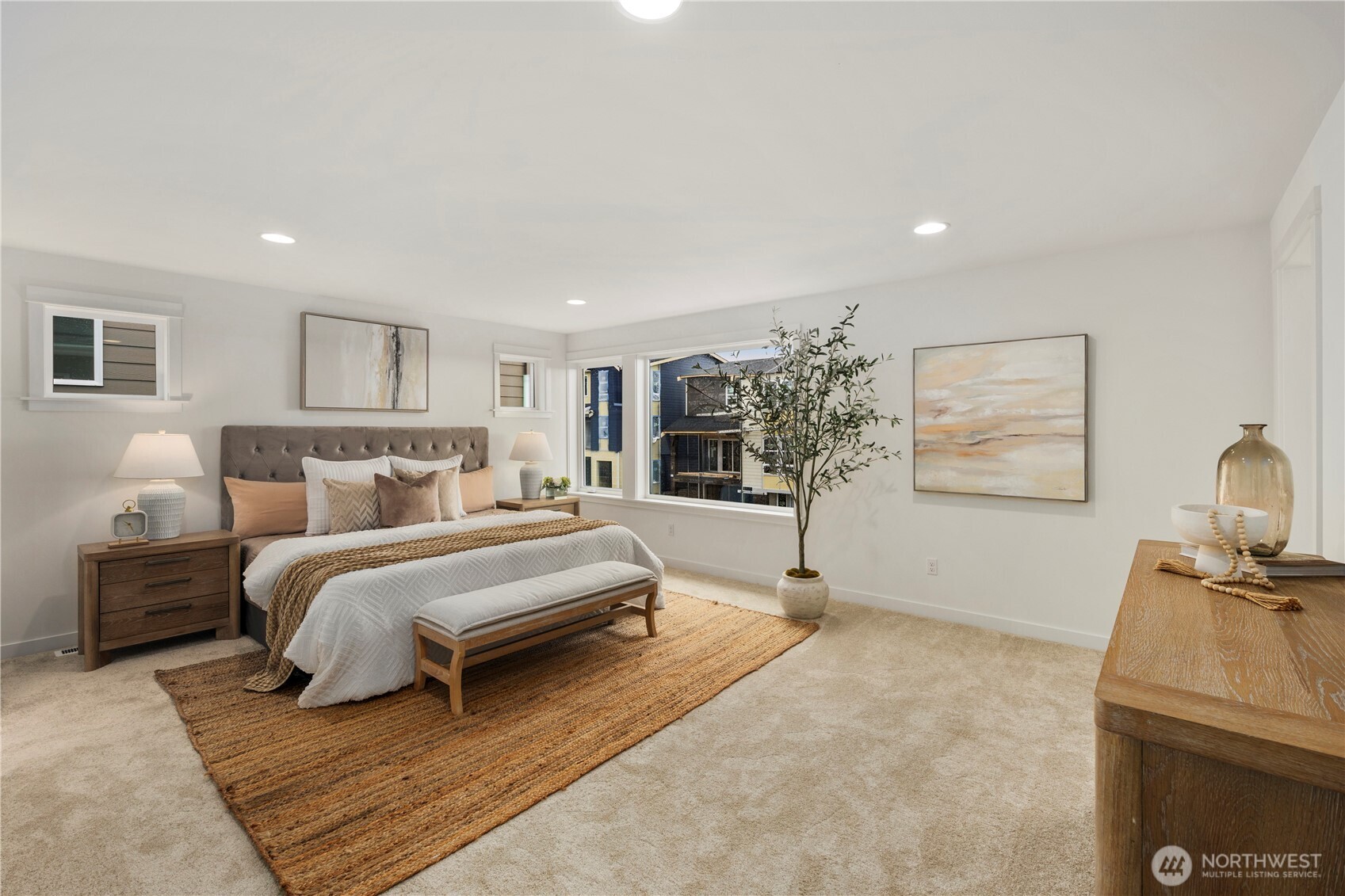 4128 220th Street Southeast Bothell, WA 98021 - Photo 19 of 31 a spacious bedroom with a bed and a flat screen tv