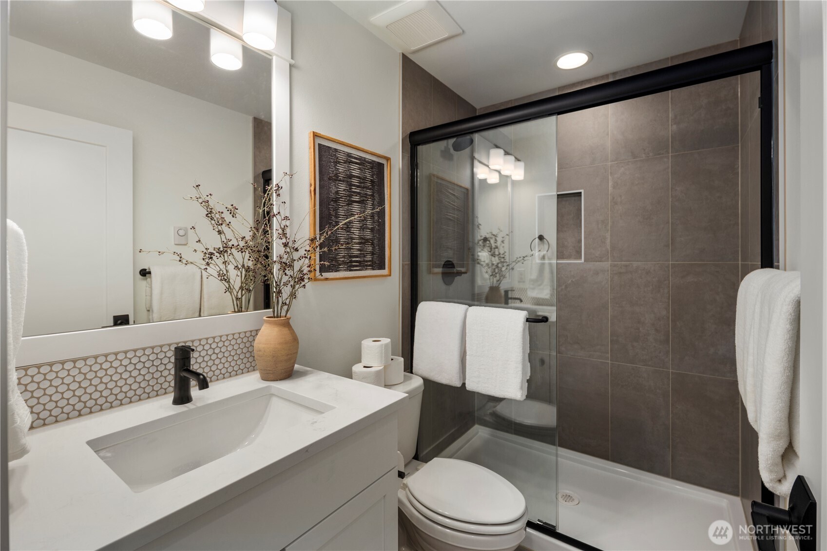 4128 220th Street Southeast Bothell, WA 98021 - Photo 30 of 31 a bathroom with a sink a toilet and shower