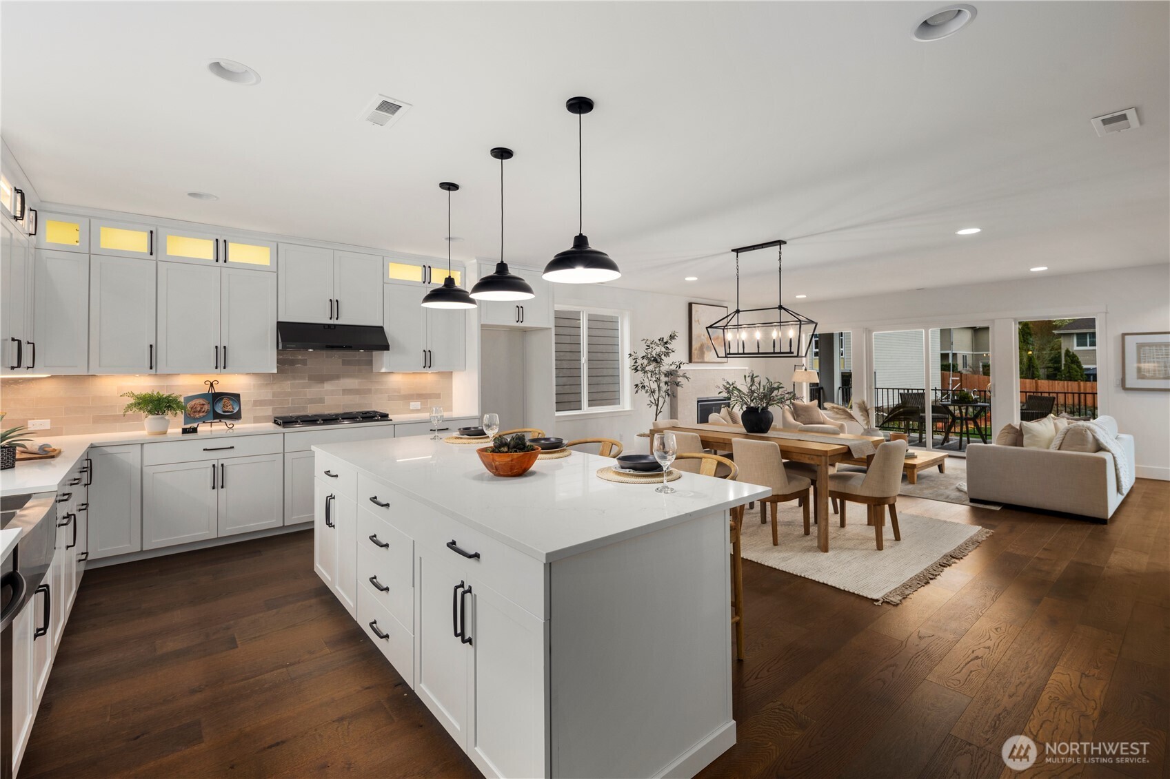 4128 220th Street Southeast Bothell, WA 98021 - Photo 9 of 31 a open kitchen with sink cabinets and wooden floor