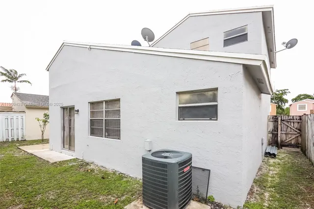 a backyard of a house with seating space