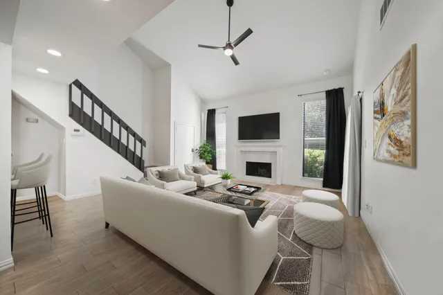a living room with furniture fireplace and a flat screen tv