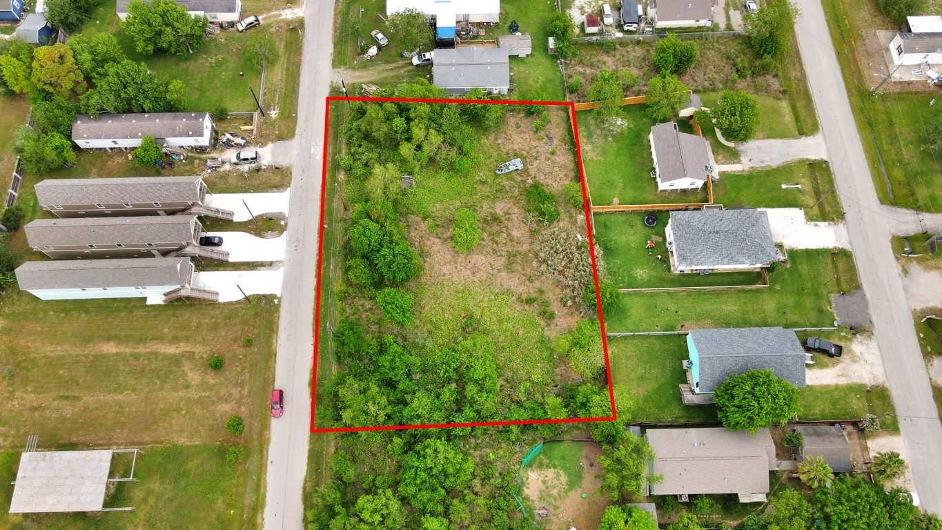 433 13th Street San Leon, TX 77539 - Photo 4 of 22 an aerial view of a residential apartment building with a yard