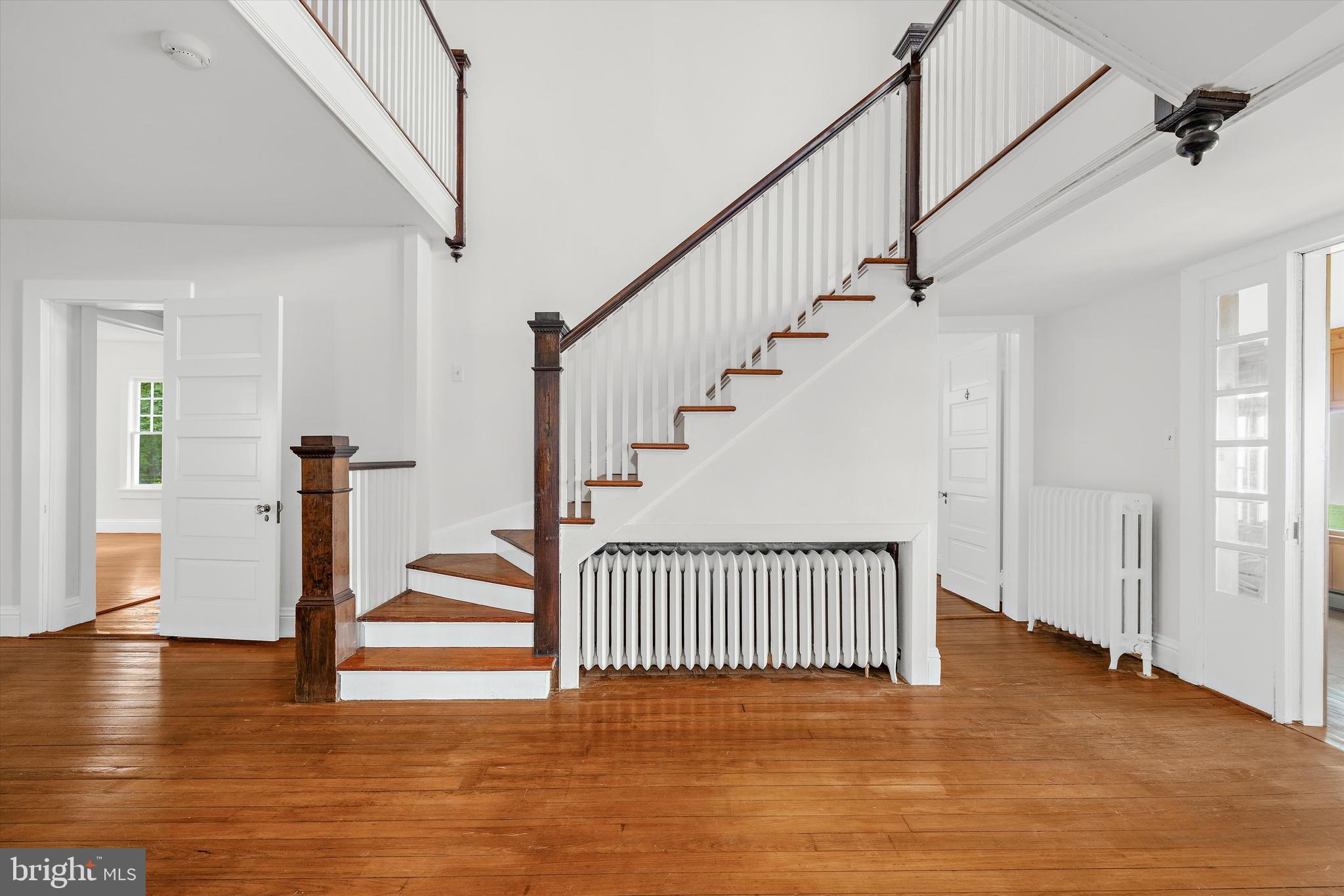 500 Nesbit Road Queenstown, MD 21658 - Photo 27 of 53 a view of entryway with wooden floor and stairs