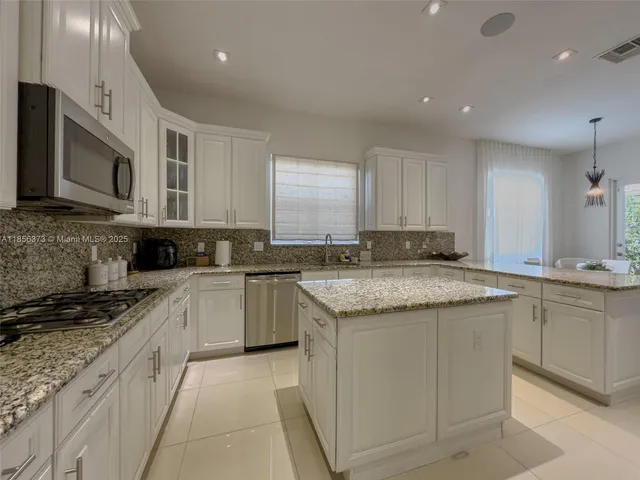 $1,310,000 | 9709 Blue Isle Bay, Parkland, FL 33076