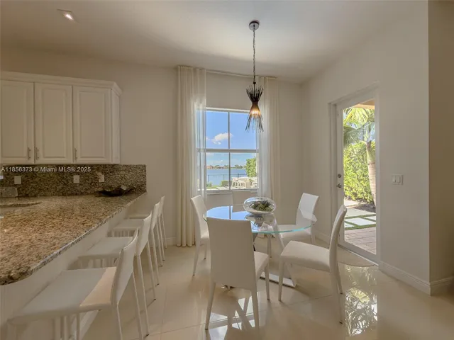 $1,310,000 | 9709 Blue Isle Bay, Parkland, FL 33076