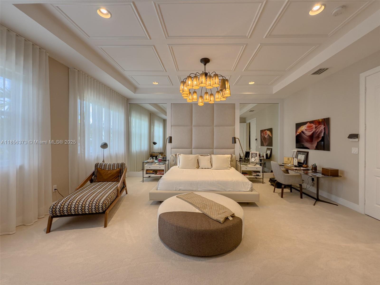 9709 Blue Isle Bay Parkland, FL 33076 - Photo 27 of 75 a living room with furniture and a chandelier