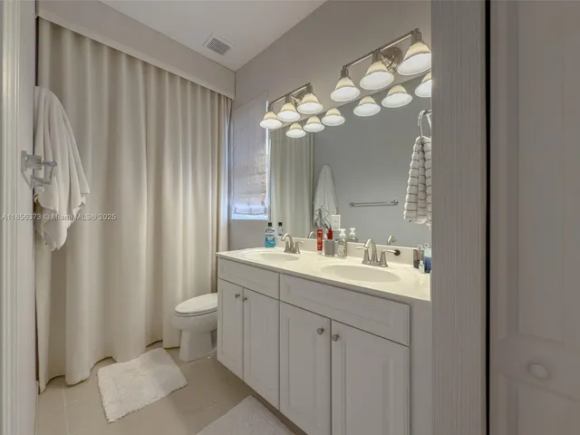 $1,310,000 | 9709 Blue Isle Bay, Parkland, FL 33076