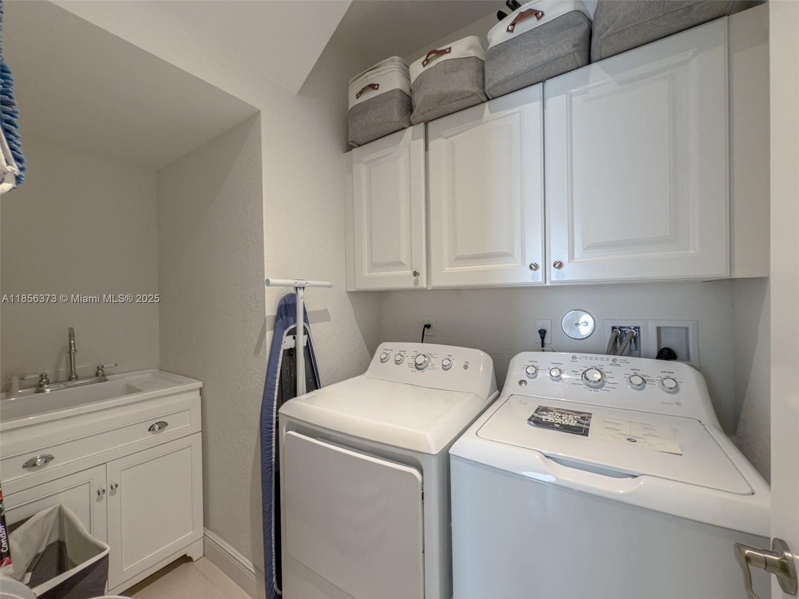 9709 Blue Isle Bay Parkland, FL 33076 - Photo 41 of 75 a utility room with dryer and washer