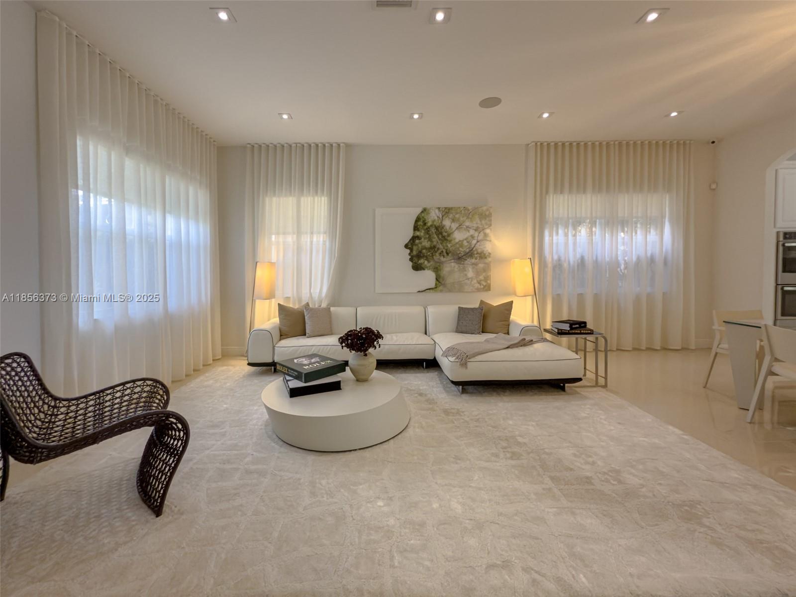9709 Blue Isle Bay Parkland, FL 33076 - Photo 5 of 75 a living room with furniture and a large window