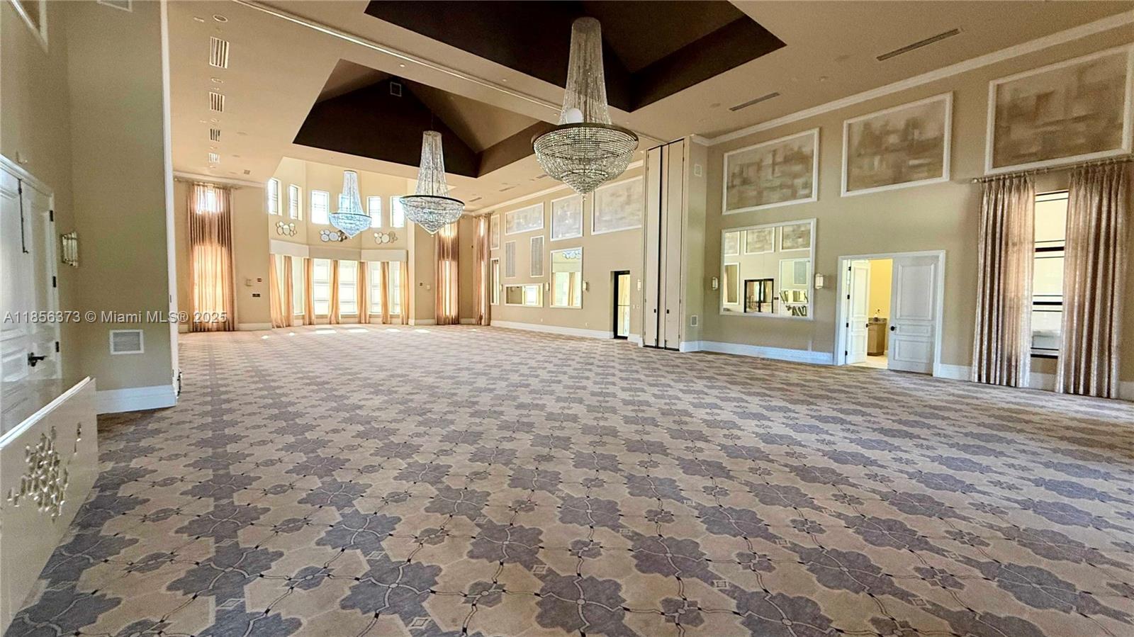 9709 Blue Isle Bay Parkland, FL 33076 - Photo 52 of 75 a large room with entrance door