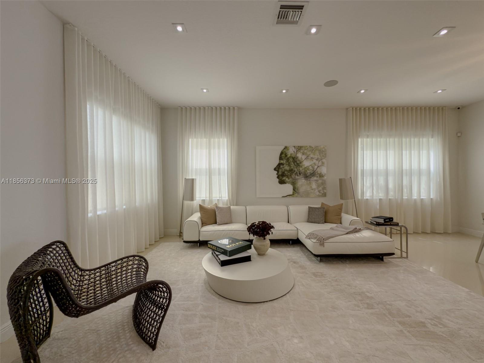 9709 Blue Isle Bay Parkland, FL 33076 - Photo 6 of 75 a living room with furniture stairs and a window