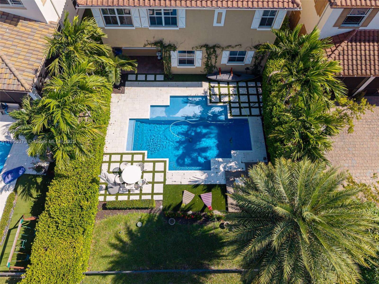 9709 Blue Isle Bay Parkland, FL 33076 - Photo 63 of 75 a view of a house with a yard